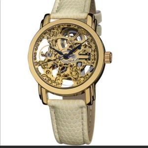 Akribos gold women’s skeleton watch